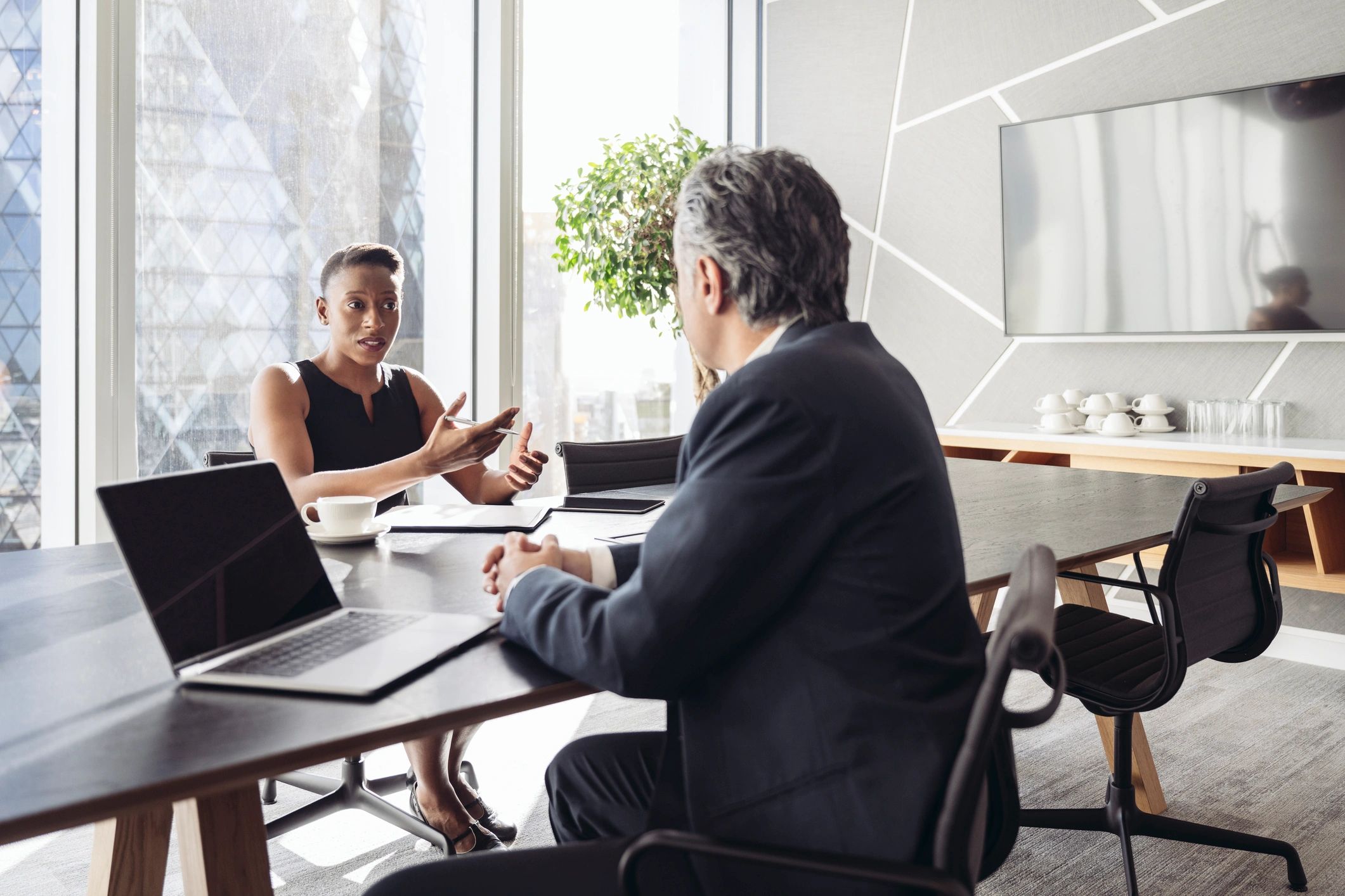 Attorney and client discussing a case at a conference table