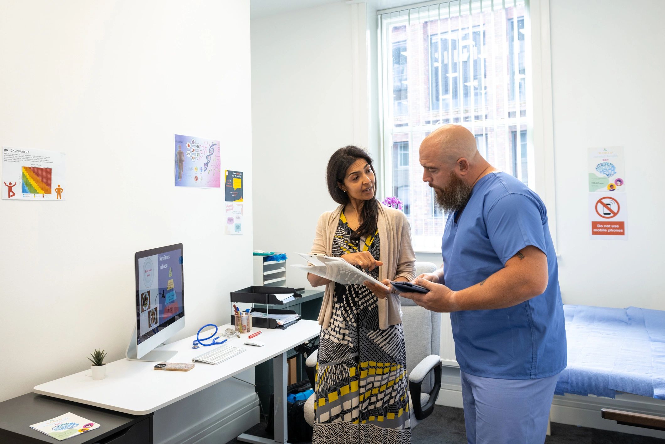 Professionals reviewing case notes in an office